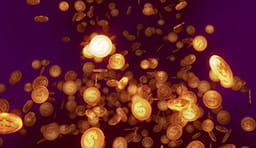 Puñados de monedas tiradas al aire.