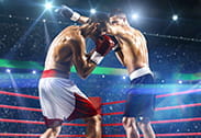 Dos púgiles en disputa durante un combate de boxeo.
