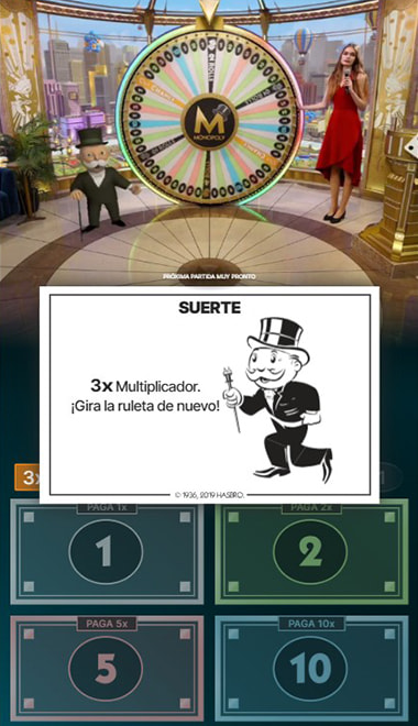 Carta de Suerte en Monopoly Live con un multiplicador de 3x y el aviso de girar la ruleta de nuevo.