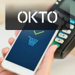 Teléfono móvil y terminal de pagos con el símbolo de OKTO.