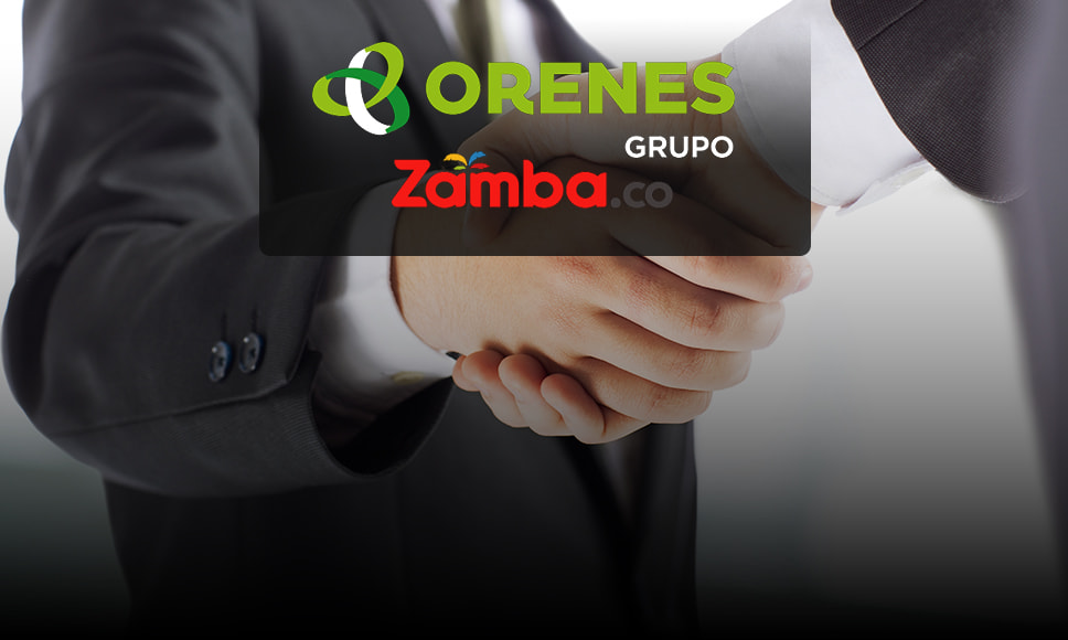 Logos del Grupo Orenes y del casino Zamba sobre el trasfondo de un apretón de manos en señal de acuerdo.