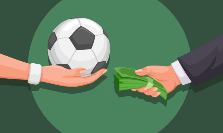 Intercambio de un balón de fútbol por un fajo de billetes.