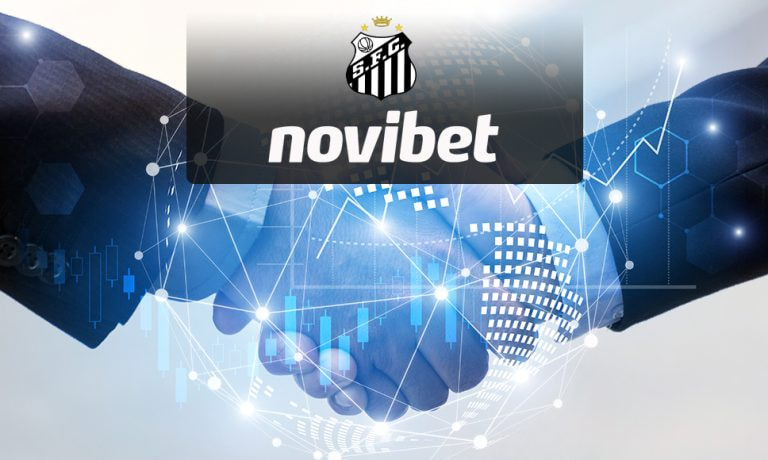 Apretón de manos con el logo del operador Novibet y del club de fútbol Santos.