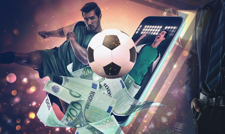 Jugador pateando una pelota de fútbol desde un teléfono móvil y billetes de 100 euros.