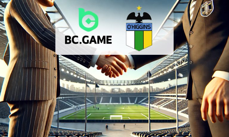 Acuerdo entre BC.GAME y el club O'Higgins sellado con apretón de manos en un estadio.