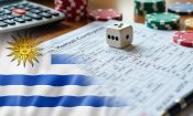 Formulario de impuestos con fichas de casino, un dado y la bandera de Uruguay al frente